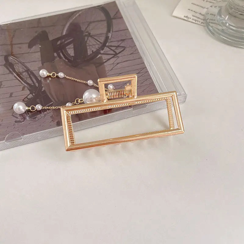 Pinza metálica para el cabello