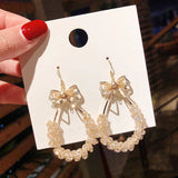 Aretes cristales con moño