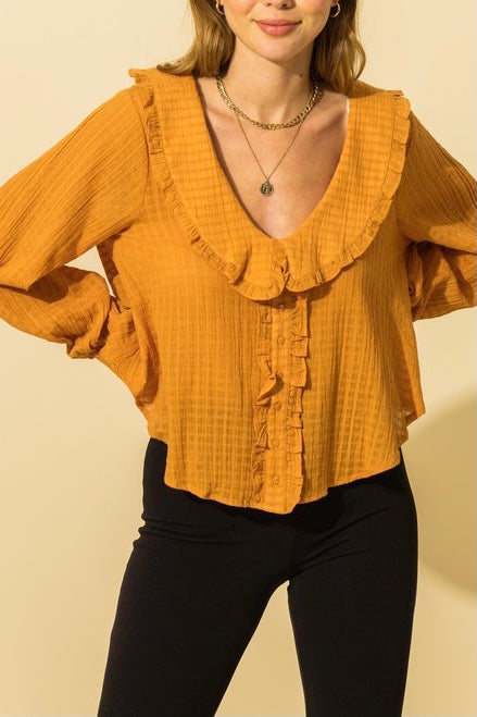 Blusa con cuello de volantes