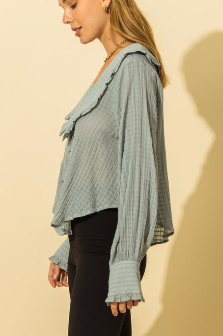 Blusa con cuello de volantes