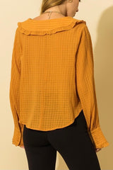 Blusa con cuello de volantes